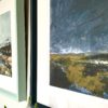 Close-up shot of a stormy Irish landscape scene print with an inky blue frame.