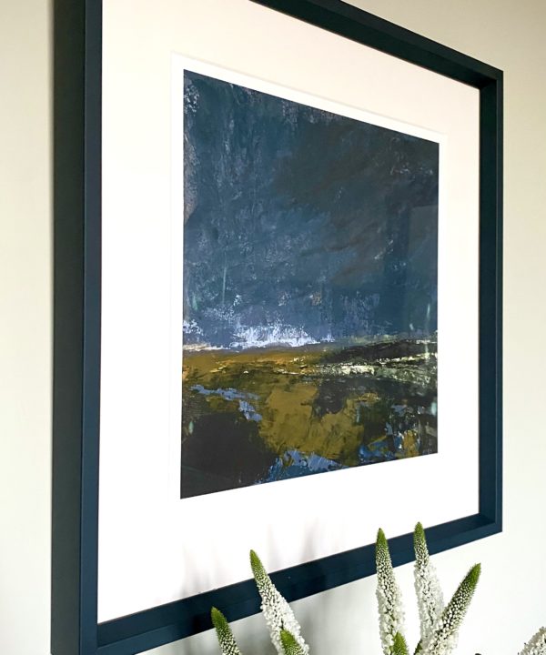 A stormy Irish landscape scene print with an inky blue frame.