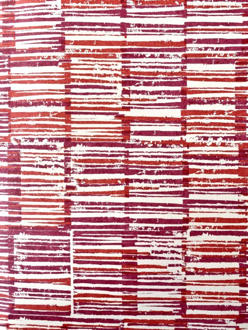 Japanese pattern wallpaper in detail showing the warm red colourway of plum and pomegranate.