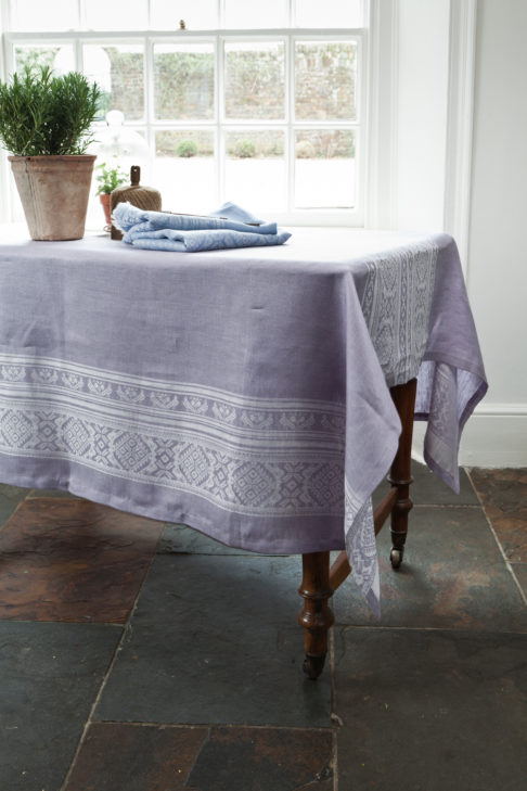 A lilac version of the Hungarian-folk-inspired tablecloth in jacquard woven linen.