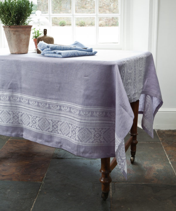 A lilac version of the Hungarian-folk-inspired tablecloth in jacquard woven linen.