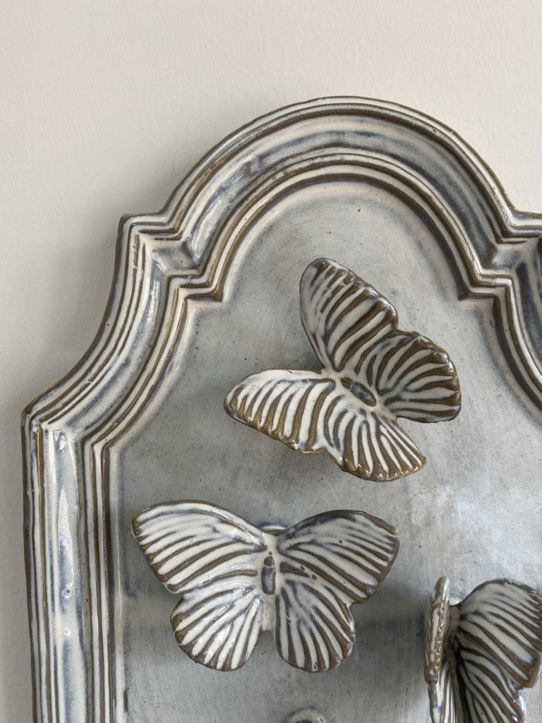 Butterfly wall art 3D ceramic plaque detail.