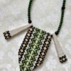 Boho statement necklace in green and black embroidered textile.