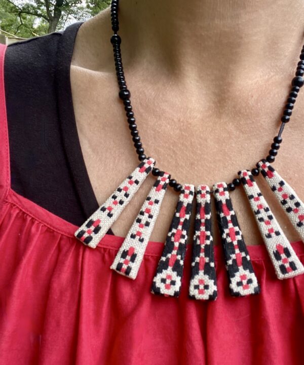 A pretty, red and black summer necklace handmade from vintage embroidered textiles.