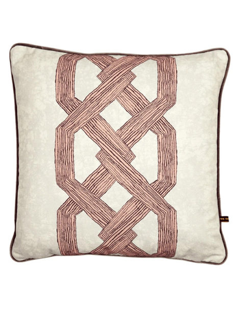 Statement pink cushion covers with a bold, architectural and African-style motif.