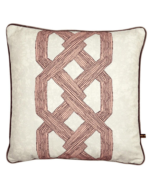 Statement pink cushion covers with a bold, architectural and African-style motif.