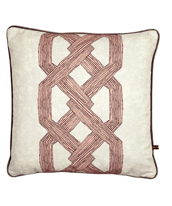 Statement pink cushion covers with a bold, architectural and African-style motif.