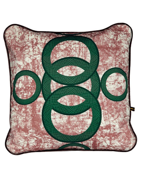 A red and green cushion with West African-inspired concentric circles motif.