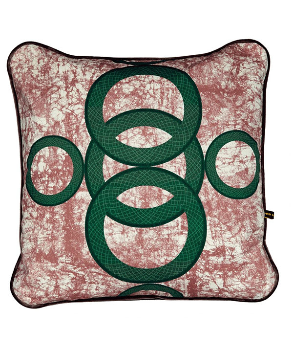 A red and green cushion with West African-inspired concentric circles motif.