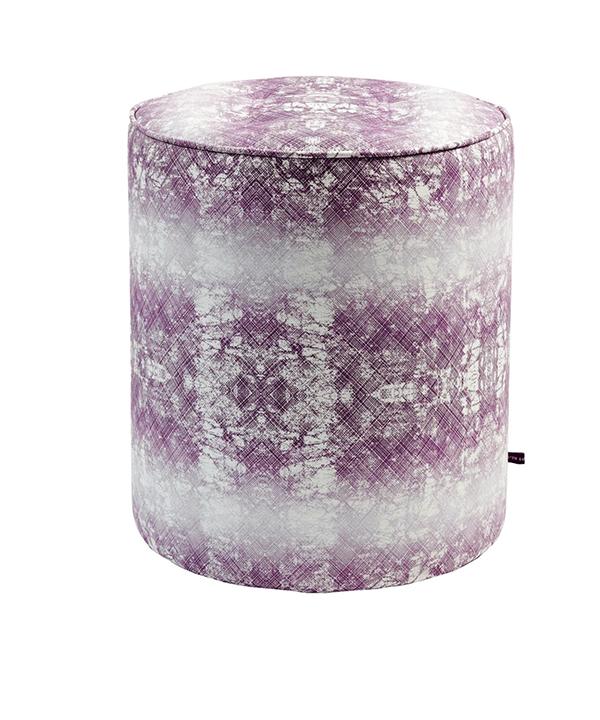 A purple pouffe with an African-inspired design with faded horizontal stripes.