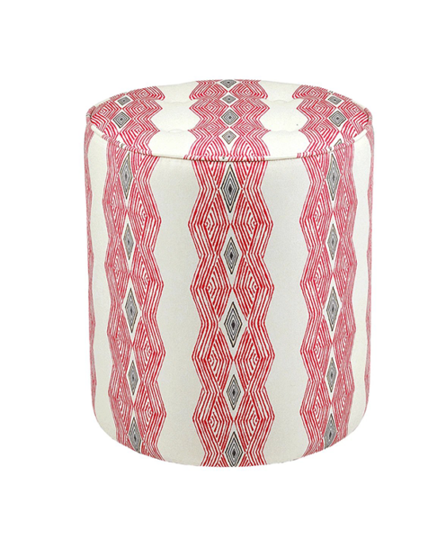 A red pouffe with African geometric stripe fabric.