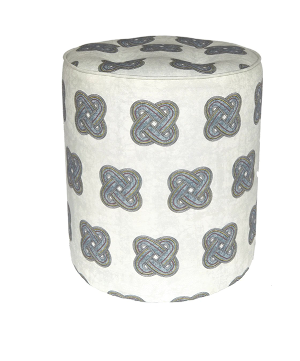 A chic, grey patterned footstool with an African knot design.