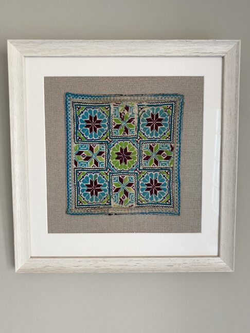 Square framed textile wall art from Northern Thailand.