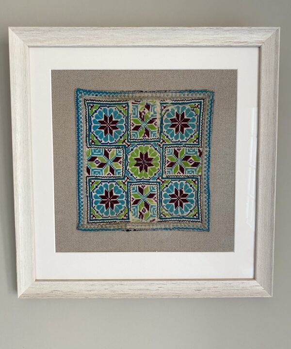 Square framed textile wall art from Northern Thailand.