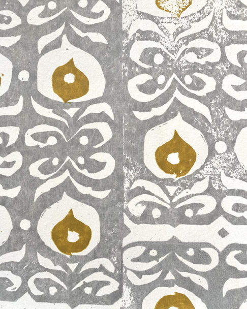 Chic, mustard and grey wallpaper, hand-printed in England but inspired by ceramic detailing from the Middle East.