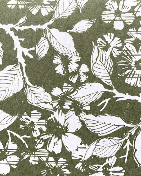 A bronze green hand-print wallpaper detail depicting a walled garden.