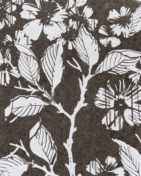 Detail of a white and charcoal-coloured wallpaper depicting a walled garden.