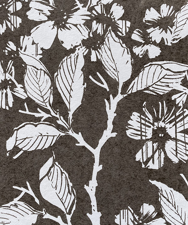 Detail of a white and charcoal-coloured wallpaper depicting a walled garden.