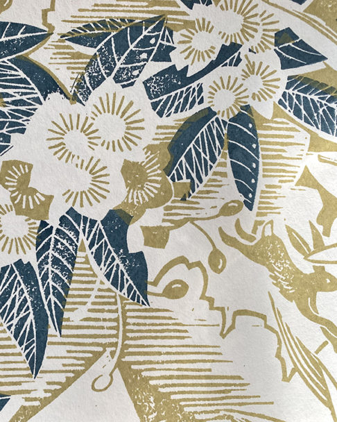 Hand-printed botanical wallpaper detail in blue and chartreuse.