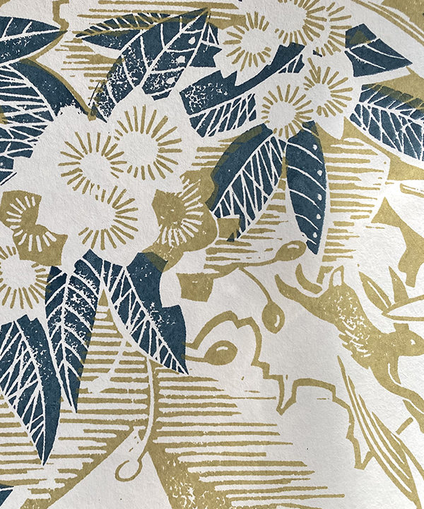 Hand-printed botanical wallpaper detail in blue and chartreuse.