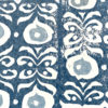 Detail of an indigo-hued, dark blue wallpaper with a Middle Eastern-inspired pattern.