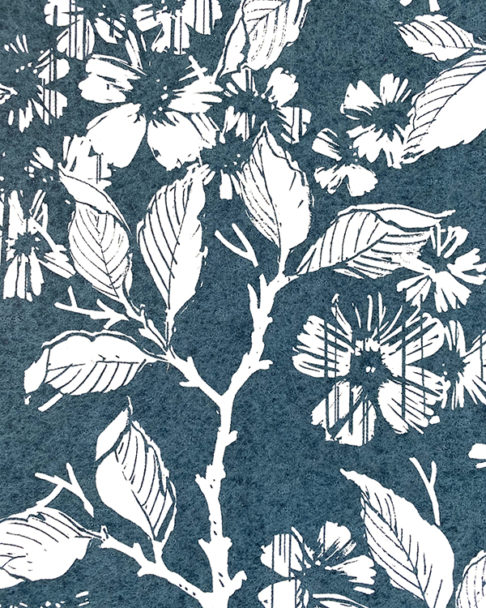 Wallpaper in indigo detail showing espaliered fruit trees in a walled garden.