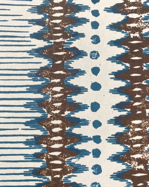 Detail of a zig-zag stripe wallpaper in blue and brown.