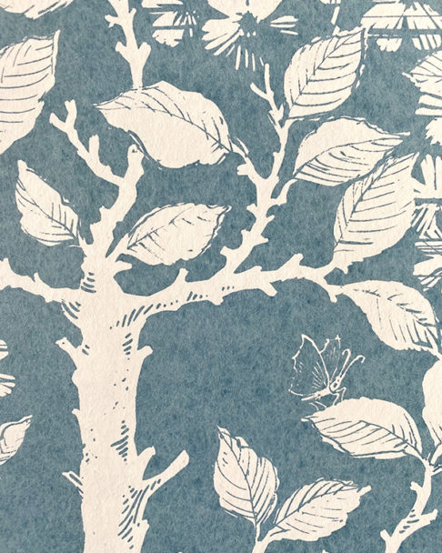 Detail of a walled garden wallpaper in blue and white.