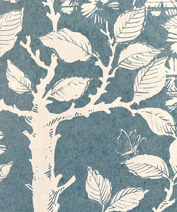 Detail of a walled garden wallpaper in blue and white.