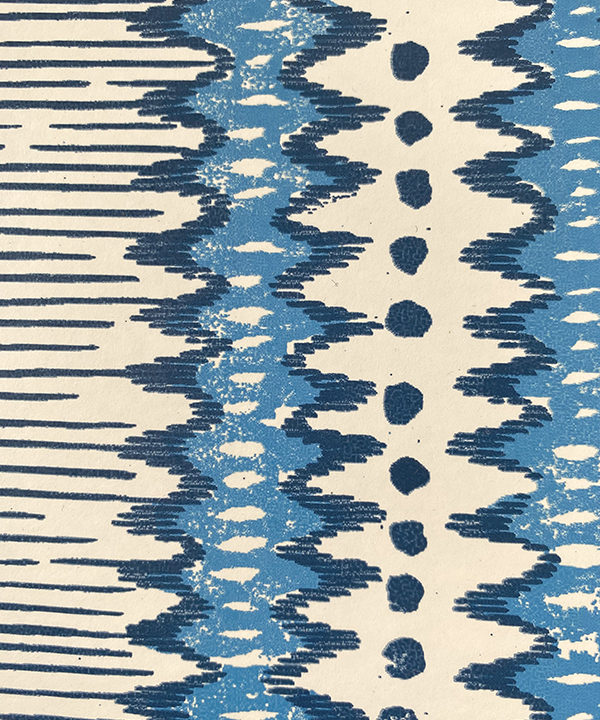 Deatila of a blue and white zig-zag stripe wallpaper.