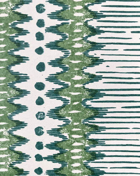 Detail of a green and white zig-zag stripe wallpaper.