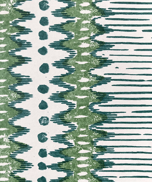 Detail of a green and white zig-zag stripe wallpaper.