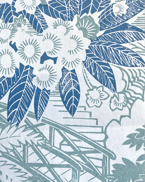 Detail of country garden wallpaper, depicting rhododendrons, in soft blues.