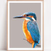 A colourful Kingfisher bird print depicting the familiar blue and orange plumage as a digital artwork shown here framed with a pale wood frame.