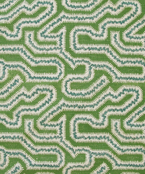 The green linen cushion fabric shown at a larger scale.