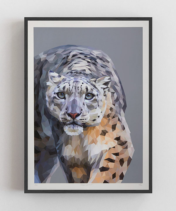 Snow leopard wall art framed with a slim black frame.