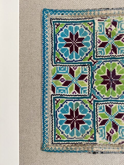 Textile wall art detail of a vintage, Thai, embroidered panel.