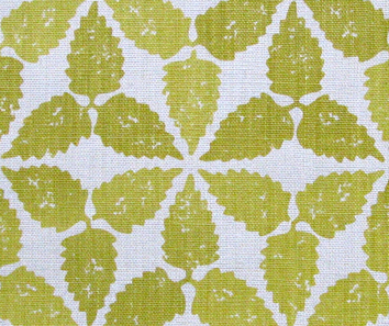 A yellow patterned cushion fabric in a Moroccan-inspired repeat hand-printed on linen.