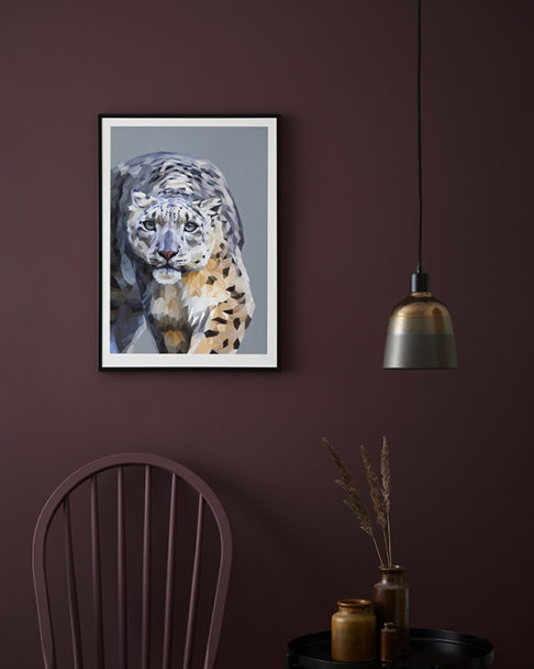 Snow leopard artwork against a deep, burgundy-coloured, painted backdrop.