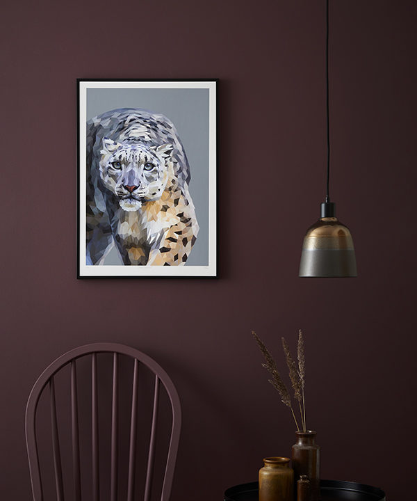 Snow leopard artwork against a deep, burgundy-coloured, painted backdrop.