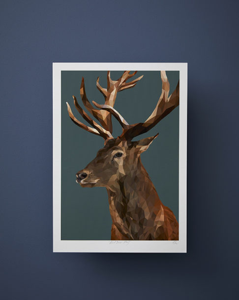 Stag print on a deep teal ground against a midnight blue wall.