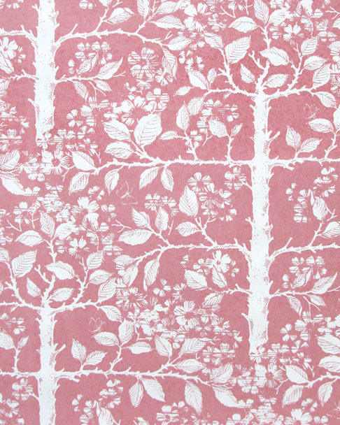 Pink floral wallpaper depicting espaliered fruit trees, hand-printed.