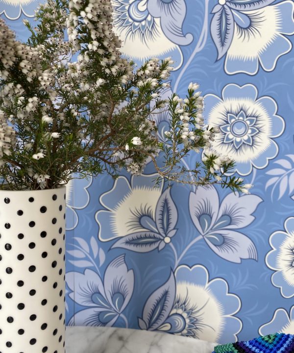 Detail of blue and white folk-inspired floral wallpaper by Olenka Design.