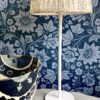 Folk art design wallpaper in Milana midnight blue available through Telescope Style.