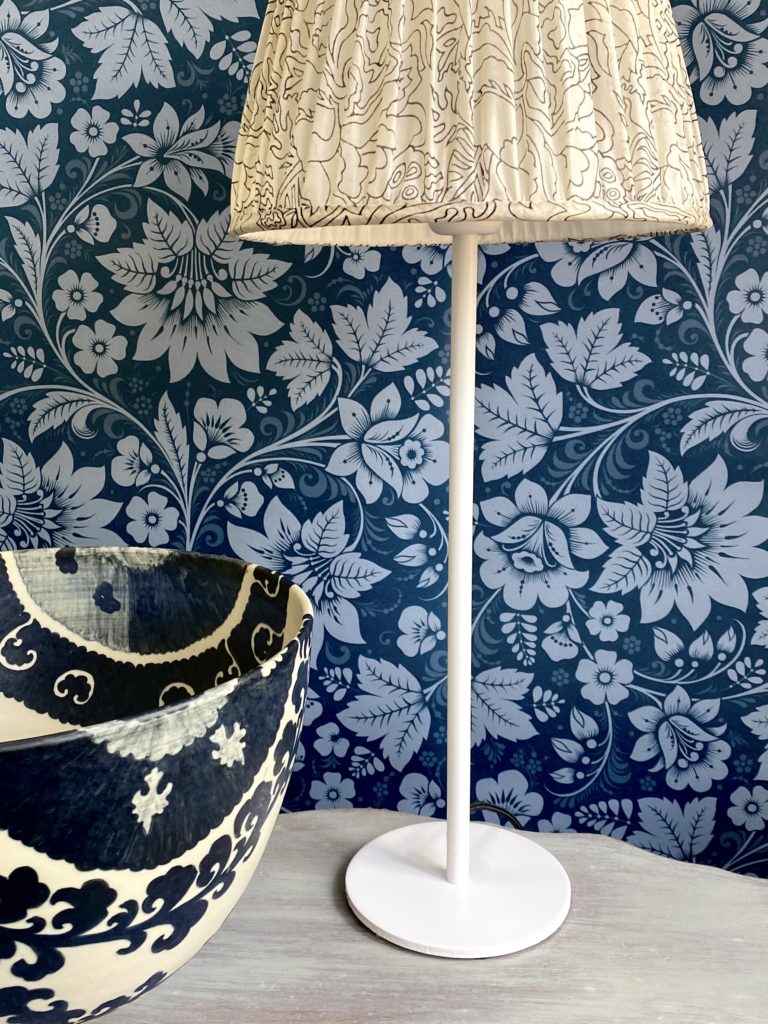 Folk art design wallpaper in Milana midnight blue available through Telescope Style.