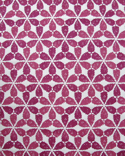 A striking, tessellated design, redolent of Moroccan courtyards, this hand-printed linen is shown here in cranberry red.