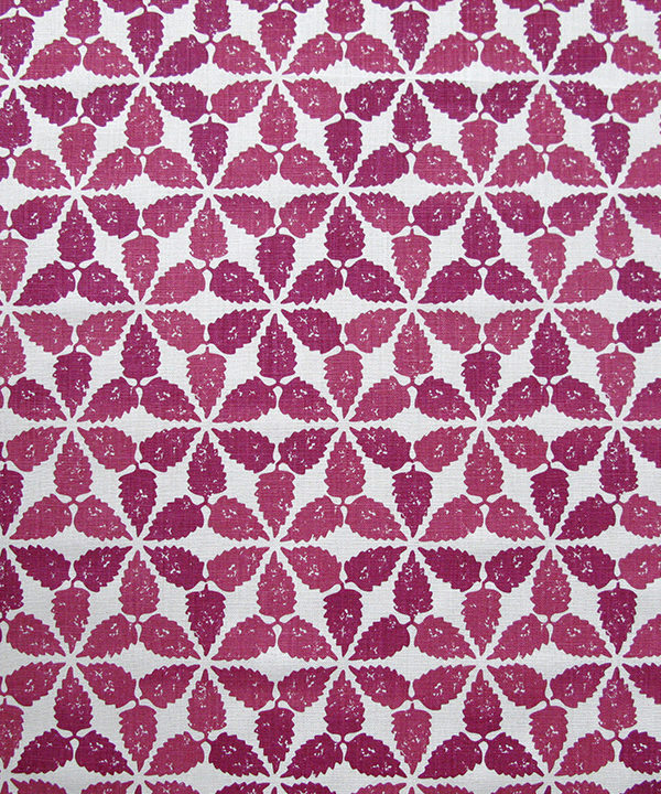 A striking, tessellated design, redolent of Moroccan courtyards, this hand-printed linen is shown here in cranberry red.