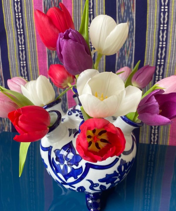 A Dutch Delft-style tulip vase displaying a cheerful array of tulips!