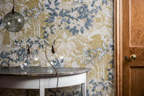 Webb's Wonder hand-printed botanical wallpaper in the chartreuse colour way in situ to give an idea of pattern and scale.