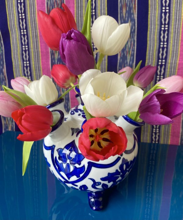 Blue and white Dutch Delft-style vase from Holland with Spring tulip display.